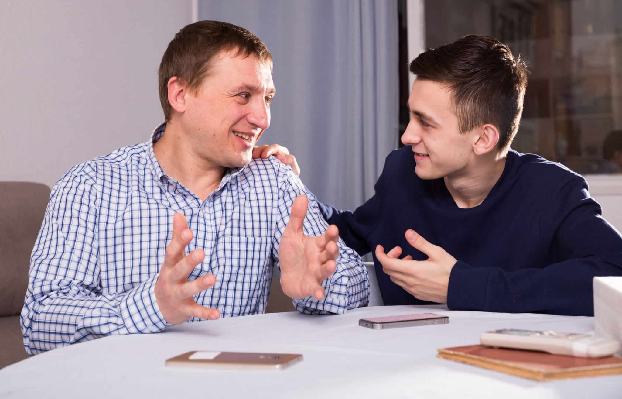 Adult,Male,With,His,Son,Are,Resting,Together,And,Talking