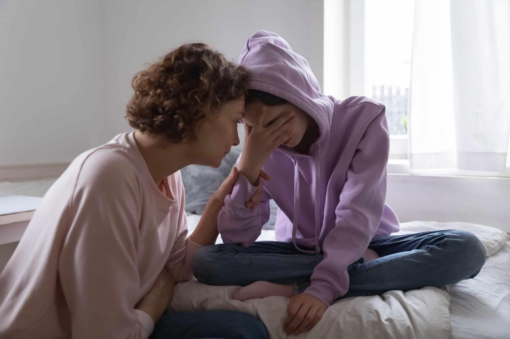 Worried,Parent,Young,Mom,Comforting,Depressed,Crying,Teen,Daughter,Bonding