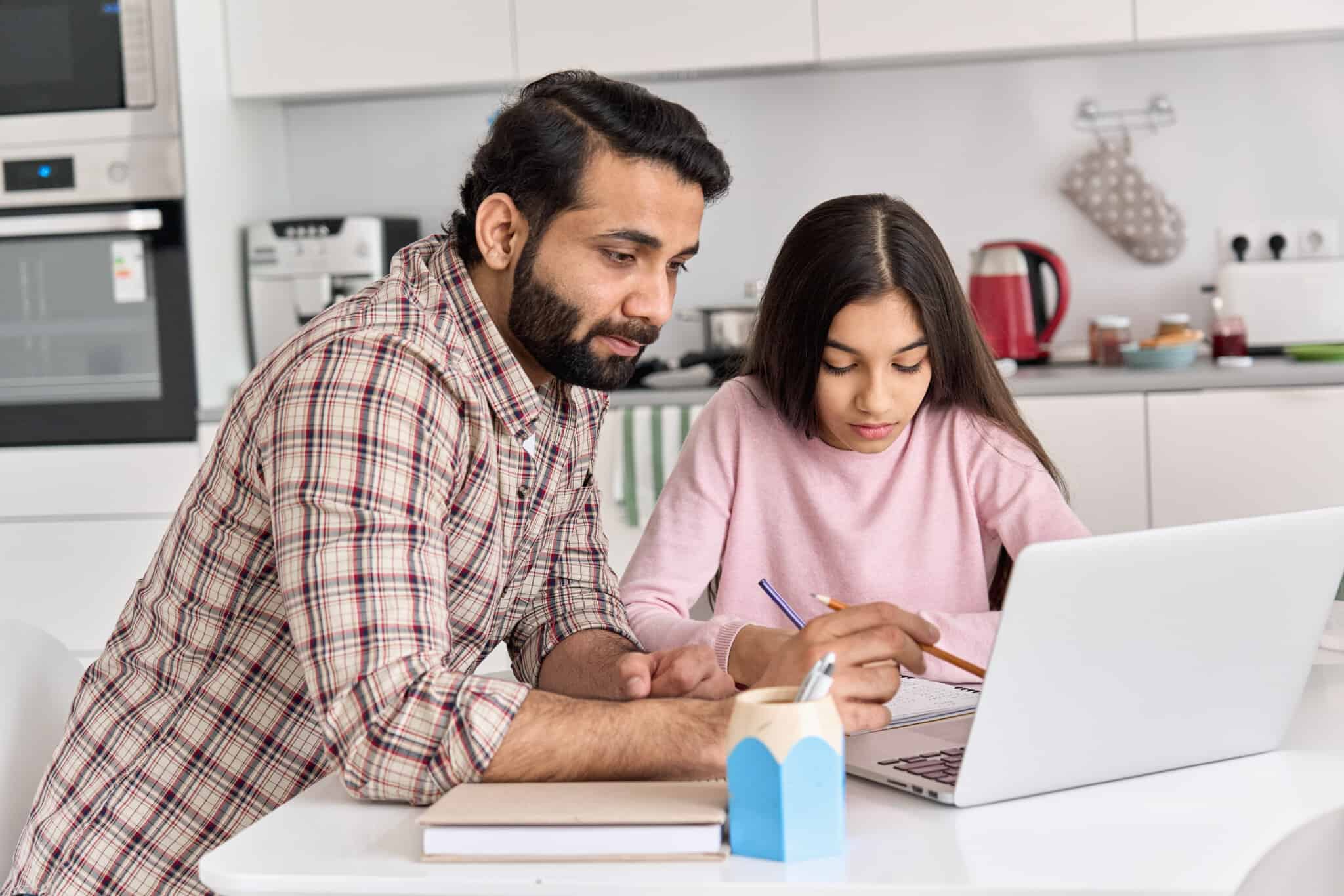 Young,Indian,Father,Helping,School,Child,Teen,Daughter,Studying,Online