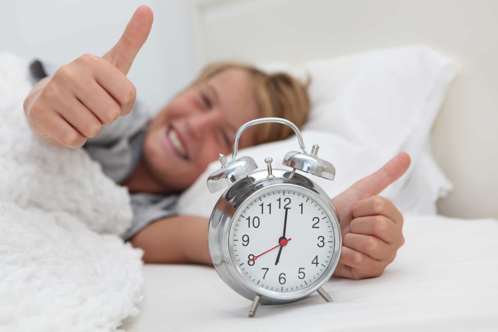 Happy,Boy,Awake,With,His,Alarm,Clock,And,Thumbs,Up